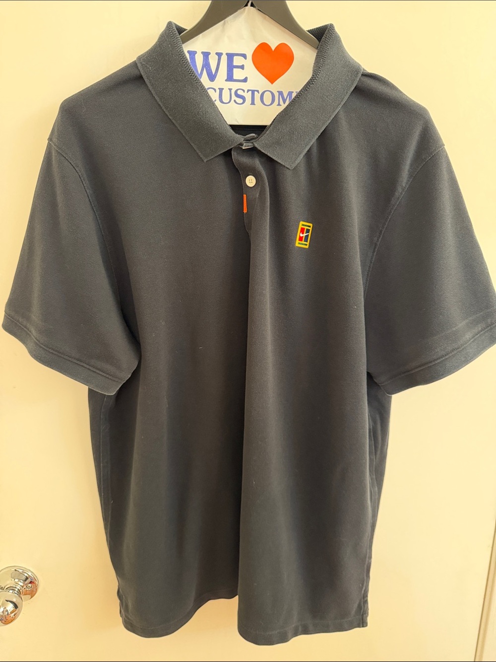 Nike Dark Gray Polo with Small Multicolor Chest Emblem